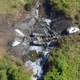 The charred remains of Gulfstream IV N121JM. The crash killed all six passengers and crew. (Massachusetts State Police/NTSB)